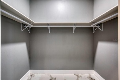 This newly remodeled 3-bedroom, 3-bathroom home in the desirable on The Grand Club - Pine Lakes Course in Florida - for sale on GolfHomes.com, golf home, golf lot