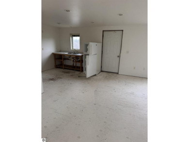 Don't miss this spacious 2,520 sq ft home located on 2.89 acres on The Pines Golf Course at Lake Isabella in Michigan - for sale on GolfHomes.com, golf home, golf lot