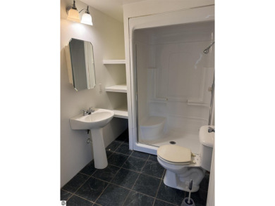 Don't miss this spacious 2,520 sq ft home located on 2.89 acres on The Pines Golf Course at Lake Isabella in Michigan - for sale on GolfHomes.com, golf home, golf lot