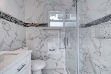 This newly remodeled 3-bedroom, 3-bathroom home in the desirable on The Grand Club - Pine Lakes Course in Florida - for sale on GolfHomes.com, golf home, golf lot