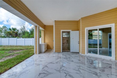 This newly remodeled 3-bedroom, 3-bathroom home in the desirable on The Grand Club - Pine Lakes Course in Florida - for sale on GolfHomes.com, golf home, golf lot