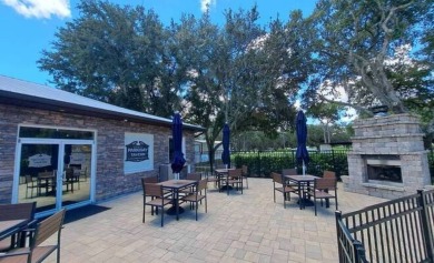 This garage is 32 feet by 22 feet, 2 separate doors, a 12-foot on Southport Springs Golf Club in Florida - for sale on GolfHomes.com, golf home, golf lot