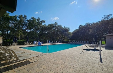 This garage is 32 feet by 22 feet, 2 separate doors, a 12-foot on Southport Springs Golf Club in Florida - for sale on GolfHomes.com, golf home, golf lot