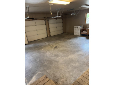 Don't miss this spacious 2,520 sq ft home located on 2.89 acres on The Pines Golf Course at Lake Isabella in Michigan - for sale on GolfHomes.com, golf home, golf lot