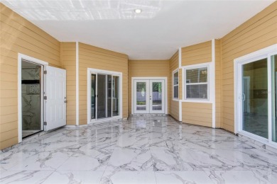 This newly remodeled 3-bedroom, 3-bathroom home in the desirable on The Grand Club - Pine Lakes Course in Florida - for sale on GolfHomes.com, golf home, golf lot