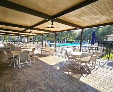 This garage is 32 feet by 22 feet, 2 separate doors, a 12-foot on Southport Springs Golf Club in Florida - for sale on GolfHomes.com, golf home, golf lot