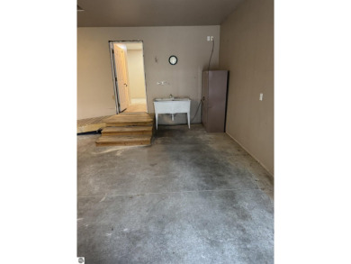 Don't miss this spacious 2,520 sq ft home located on 2.89 acres on The Pines Golf Course at Lake Isabella in Michigan - for sale on GolfHomes.com, golf home, golf lot