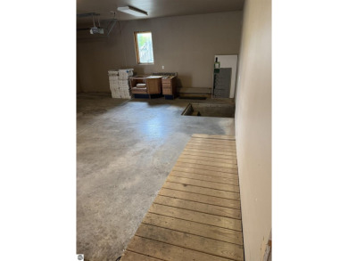 Don't miss this spacious 2,520 sq ft home located on 2.89 acres on The Pines Golf Course at Lake Isabella in Michigan - for sale on GolfHomes.com, golf home, golf lot