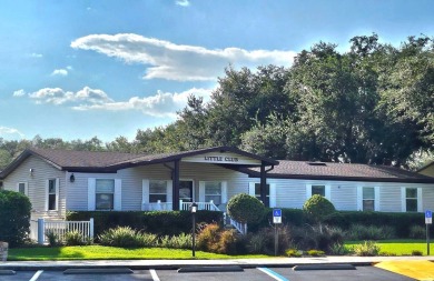 This garage is 32 feet by 22 feet, 2 separate doors, a 12-foot on Southport Springs Golf Club in Florida - for sale on GolfHomes.com, golf home, golf lot