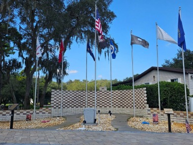 This garage is 32 feet by 22 feet, 2 separate doors, a 12-foot on Southport Springs Golf Club in Florida - for sale on GolfHomes.com, golf home, golf lot