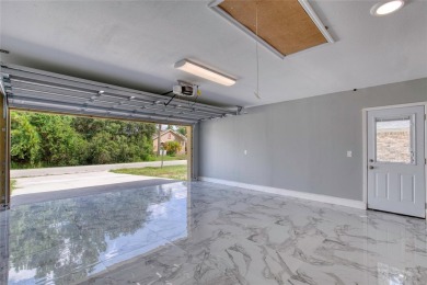 This newly remodeled 3-bedroom, 3-bathroom home in the desirable on The Grand Club - Pine Lakes Course in Florida - for sale on GolfHomes.com, golf home, golf lot