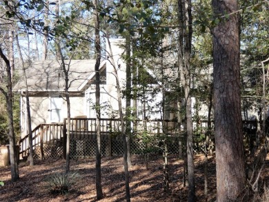Nestled on a heavily wooded lot this 2BD-2BA home is a perfect on Holly Lake Ranch Golf Club in Texas - for sale on GolfHomes.com, golf home, golf lot
