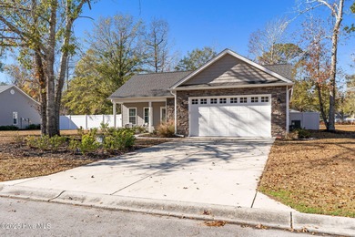 Welcome to your ideal coastal escape! This charming one-story on Sea Trail Golf Resort in North Carolina - for sale on GolfHomes.com, golf home, golf lot