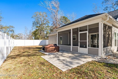 Welcome to your ideal coastal escape! This charming one-story on Sea Trail Golf Resort in North Carolina - for sale on GolfHomes.com, golf home, golf lot