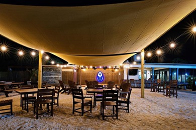 This high and dry lot overlooks a pond and the 12th green on St. James Bay in Florida - for sale on GolfHomes.com, golf home, golf lot