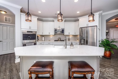 Introducing 16215 Lakeside Loop Lane - a meticulously maintained on The Peninsula Club in North Carolina - for sale on GolfHomes.com, golf home, golf lot