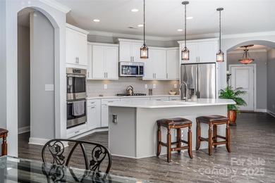 Introducing 16215 Lakeside Loop Lane - a meticulously maintained on The Peninsula Club in North Carolina - for sale on GolfHomes.com, golf home, golf lot