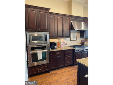 Showcase listing in the gated townhomes in Windermere Golf & on Windermere Golf Club in Georgia - for sale on GolfHomes.com, golf home, golf lot