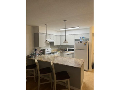 This is a ground-level condo nestled on a golf course in the on Ocean Village Golf Course in Florida - for sale on GolfHomes.com, golf home, golf lot