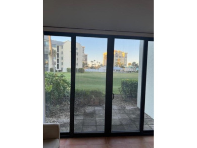 This is a ground-level condo nestled on a golf course in the on Ocean Village Golf Course in Florida - for sale on GolfHomes.com, golf home, golf lot
