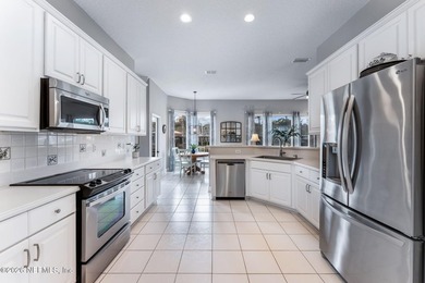 Tucked along a tranquil lagoon inside the prestigious on Jacksonville Golf and Country Club in Florida - for sale on GolfHomes.com, golf home, golf lot