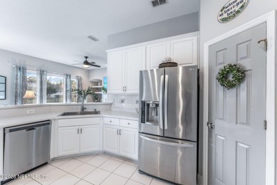 Tucked along a tranquil lagoon inside the prestigious on Jacksonville Golf and Country Club in Florida - for sale on GolfHomes.com, golf home, golf lot