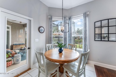 Tucked along a tranquil lagoon inside the prestigious on Jacksonville Golf and Country Club in Florida - for sale on GolfHomes.com, golf home, golf lot