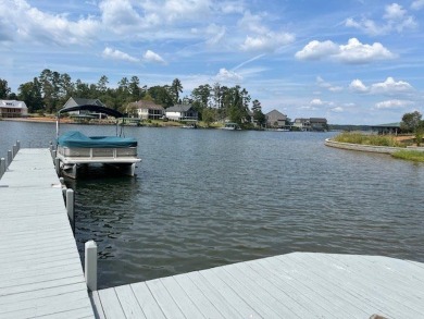 Experience the pinnacle of lakefront luxury in this stunning on The Patriot Golf Club At Grand Harbor in South Carolina - for sale on GolfHomes.com, golf home, golf lot