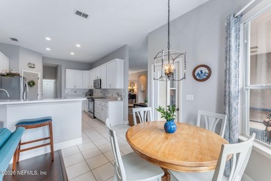 Tucked along a tranquil lagoon inside the prestigious on Jacksonville Golf and Country Club in Florida - for sale on GolfHomes.com, golf home, golf lot