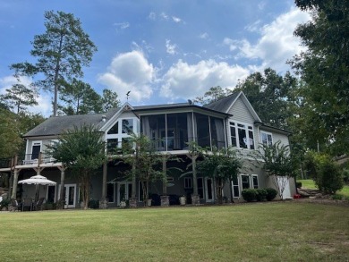 Experience the pinnacle of lakefront luxury in this stunning on The Patriot Golf Club At Grand Harbor in South Carolina - for sale on GolfHomes.com, golf home, golf lot