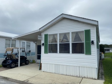 THIS LAKEFRONT COTTAGE STYLE HOME IN AN ALL AGES COMMUNITY WILL on Silver Dollar Golf and Trap Club in Florida - for sale on GolfHomes.com, golf home, golf lot