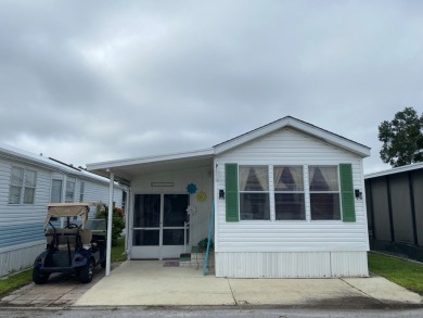 THIS LAKEFRONT COTTAGE STYLE HOME IN AN ALL AGES COMMUNITY WILL on Silver Dollar Golf and Trap Club in Florida - for sale on GolfHomes.com, golf home, golf lot