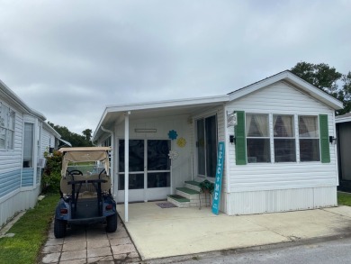 THIS LAKEFRONT COTTAGE STYLE HOME IN AN ALL AGES COMMUNITY WILL on Silver Dollar Golf and Trap Club in Florida - for sale on GolfHomes.com, golf home, golf lot