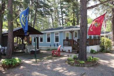 This 2 bedroom 1.5 bath Chariot Eagle Park Model with attached on Indian Mound Golf Club in New Hampshire - for sale on GolfHomes.com, golf home, golf lot