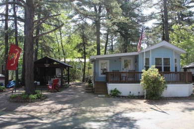 This 2 bedroom 1.5 bath Chariot Eagle Park Model with attached on Indian Mound Golf Club in New Hampshire - for sale on GolfHomes.com, golf home, golf lot