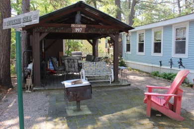 This 2 bedroom 1.5 bath Chariot Eagle Park Model with attached on Indian Mound Golf Club in New Hampshire - for sale on GolfHomes.com, golf home, golf lot