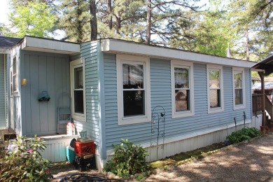 This 2 bedroom 1.5 bath Chariot Eagle Park Model with attached on Indian Mound Golf Club in New Hampshire - for sale on GolfHomes.com, golf home, golf lot