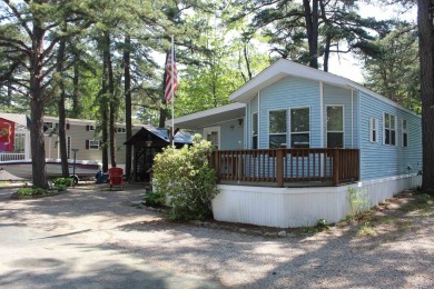 This 2 bedroom 1.5 bath Chariot Eagle Park Model with attached on Indian Mound Golf Club in New Hampshire - for sale on GolfHomes.com, golf home, golf lot