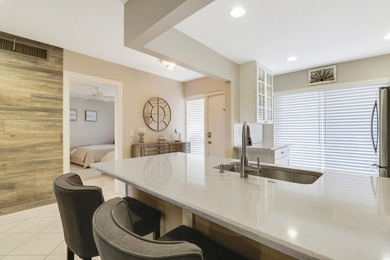 Spacious and stylish, this 2 bed/2 bath first-floor condo is on BallenIsles Golf and Country Club in Florida - for sale on GolfHomes.com, golf home, golf lot