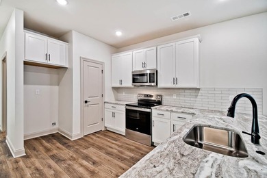 Experience effortless living in these brand-new patio homes on Big Creek Golf and Country Club in Arkansas - for sale on GolfHomes.com, golf home, golf lot