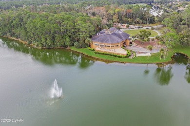 Nestled on a quiet, no-through street in Plantation Bay's on Plantation Bay Golf and Country Club in Florida - for sale on GolfHomes.com, golf home, golf lot