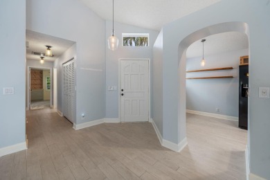 Welcome home to this 3 bedroom, 2 bathroom waterfront home in on Breakers Rees Jones Course in Florida - for sale on GolfHomes.com, golf home, golf lot