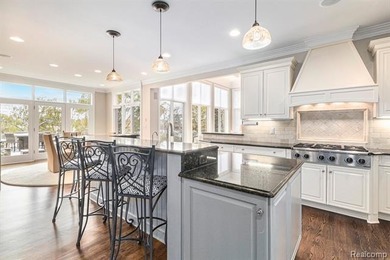 Perched gracefully above the landscape, this Oakhurst residence on Oakhurst Golf and Country Club in Michigan - for sale on GolfHomes.com, golf home, golf lot