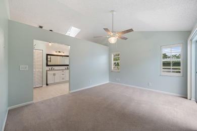 Welcome home to this 3 bedroom, 2 bathroom waterfront home in on Breakers Rees Jones Course in Florida - for sale on GolfHomes.com, golf home, golf lot