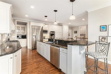 Perched gracefully above the landscape, this Oakhurst residence on Oakhurst Golf and Country Club in Michigan - for sale on GolfHomes.com, golf home, golf lot