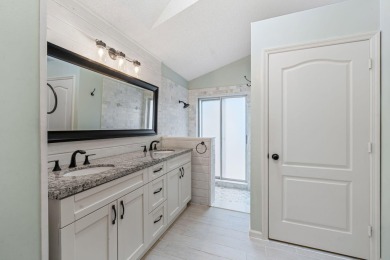 Welcome home to this 3 bedroom, 2 bathroom waterfront home in on Breakers Rees Jones Course in Florida - for sale on GolfHomes.com, golf home, golf lot