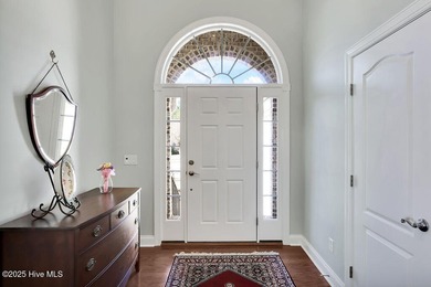 Serene nature views await you in this stunning brick home on Cape Fear National At Brunswick Forest in North Carolina - for sale on GolfHomes.com, golf home, golf lot