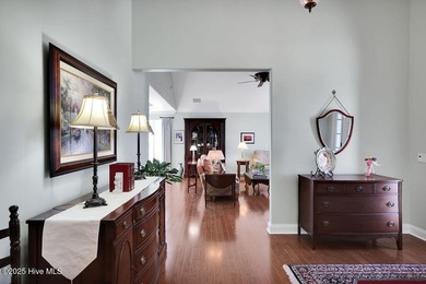 Serene nature views await you in this stunning brick home on Cape Fear National At Brunswick Forest in North Carolina - for sale on GolfHomes.com, golf home, golf lot