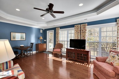 Serene nature views await you in this stunning brick home on Cape Fear National At Brunswick Forest in North Carolina - for sale on GolfHomes.com, golf home, golf lot