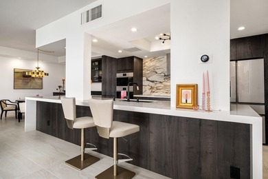 A sophisticated desert retreat in the guard-gated Desert Island on Desert Island Golf and Country Club in California - for sale on GolfHomes.com, golf home, golf lot